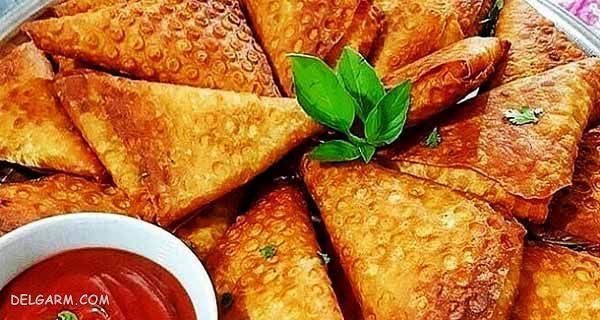 دستور تهیه سمبوسه پیتزایی با طعمی منحصر به فرد (مرحله به مرحله) دستور تهیه سمبوسه پیتزایی با طعمی منحصر به فرد (مرحله به مرحله)